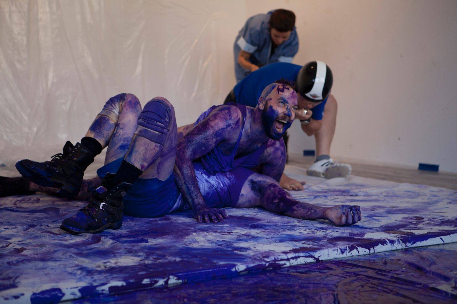 Giant Yves Klein All Out Attack: a performer covered in blue-purple paint